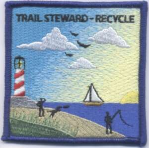 Trail steward recycle patch with beach and light house, fisherman, sailboat, and person with dog